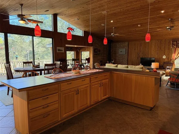 a kitchen with stainless steel appliances granite countertop a stove sink and cabinets