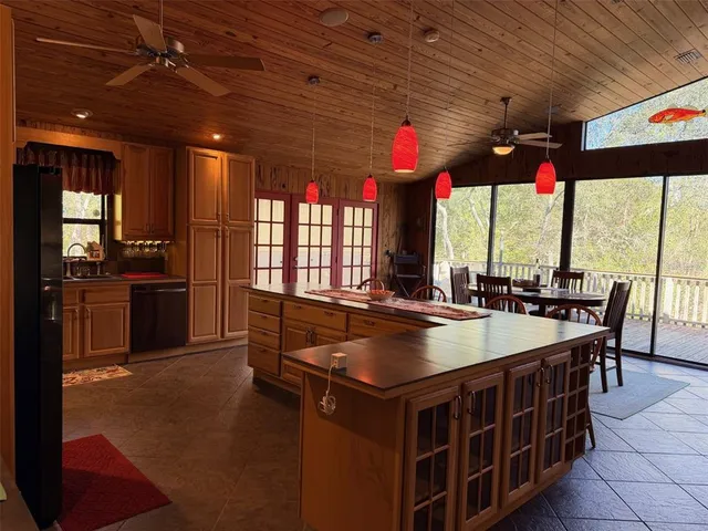 a living room with a table and a large window