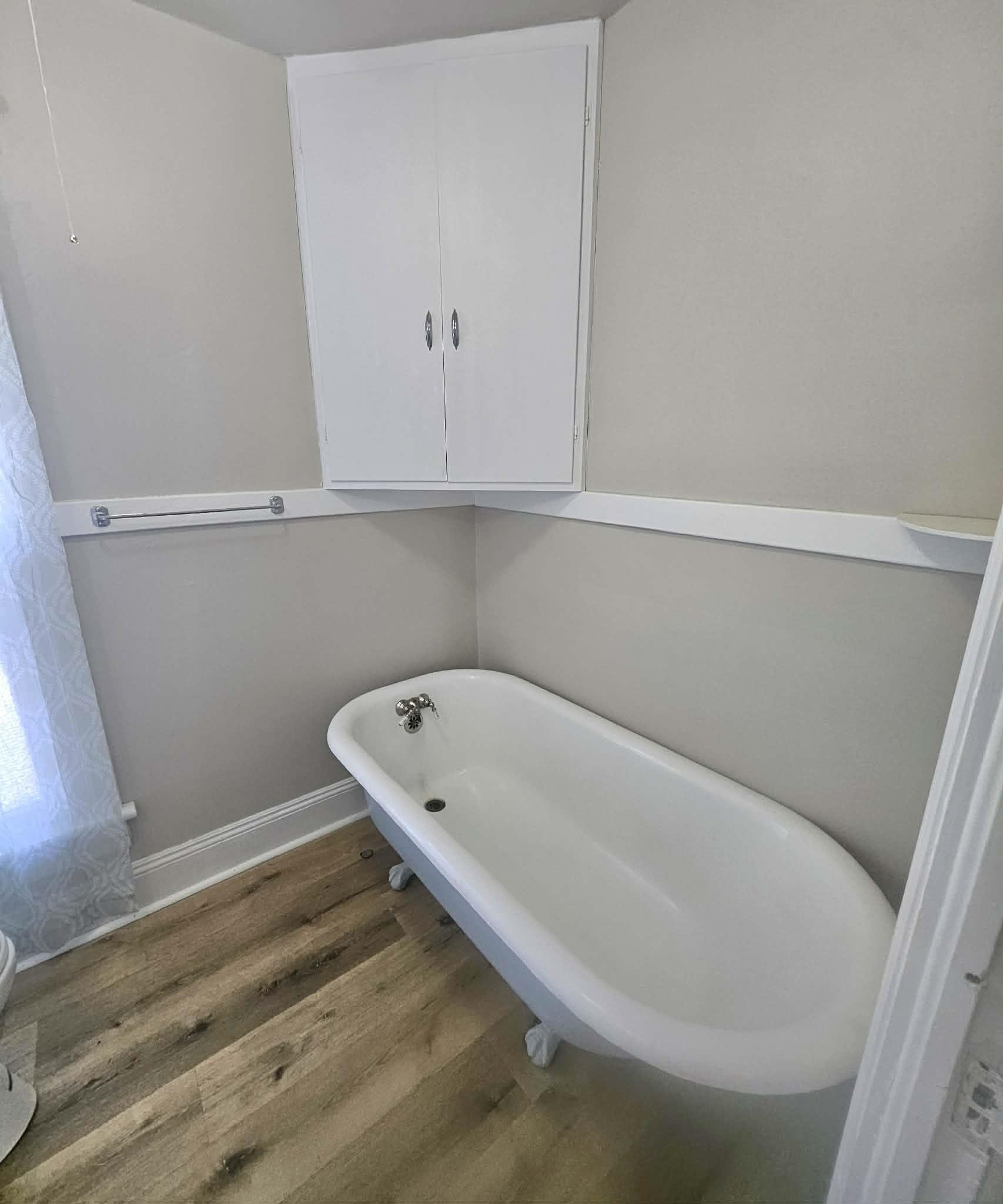 828 9th Street Beloit, WI 53511 - Photo 11 of 23 a bathroom with a bathtub