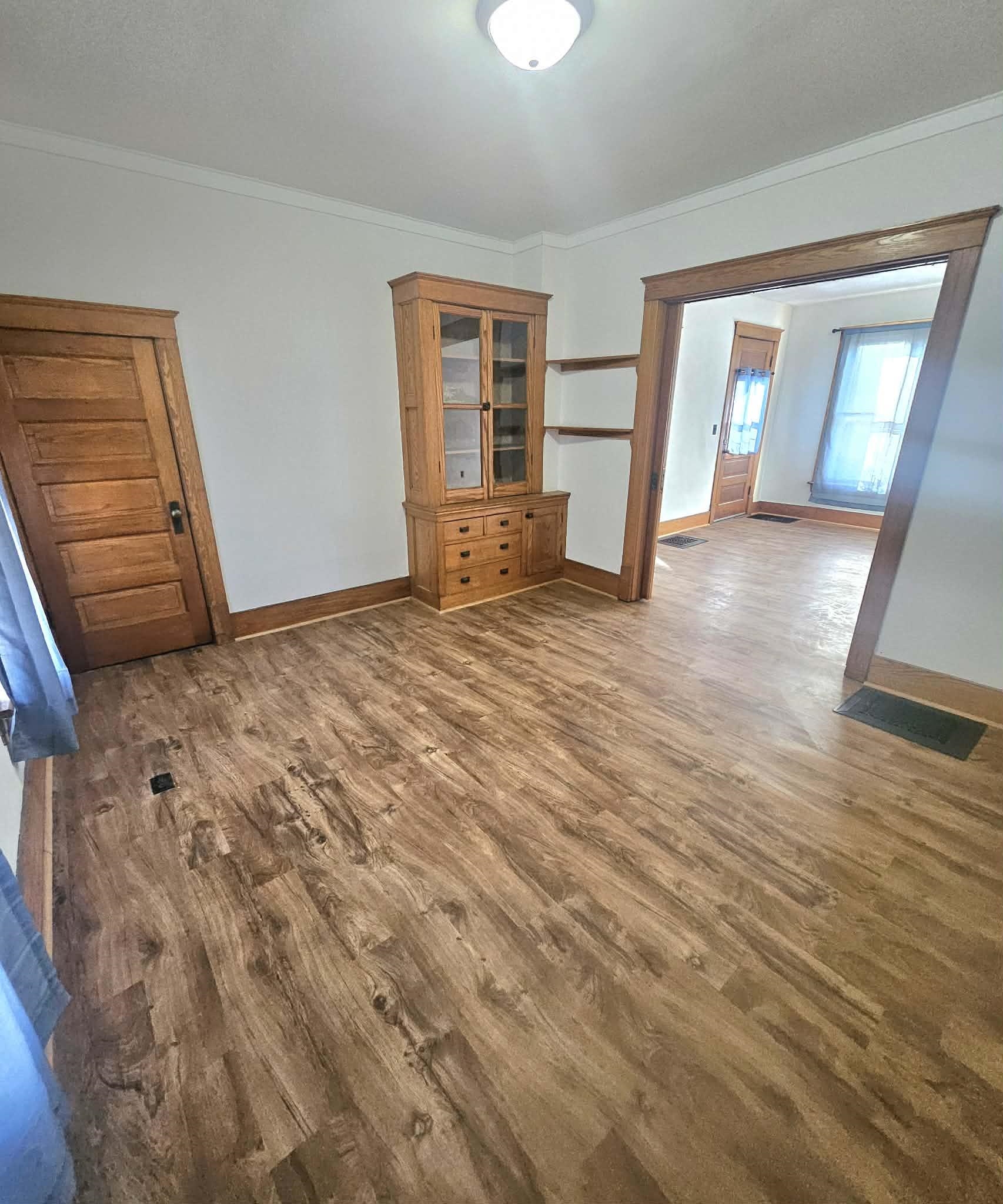 828 9th Street Beloit, WI 53511 - Photo 19 of 23 a view of empty room with wooden floor and fan
