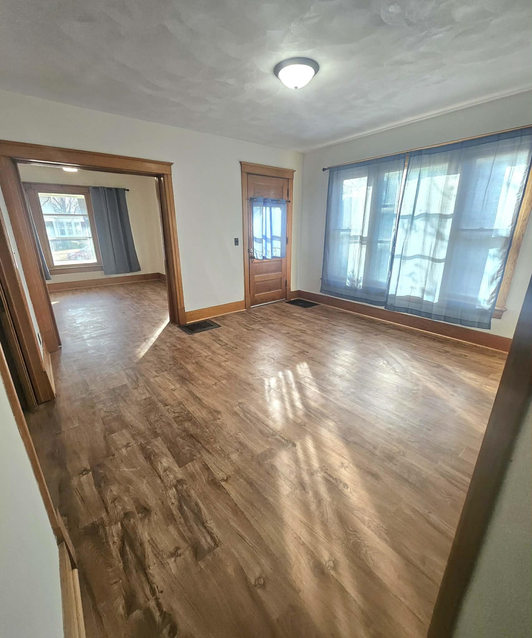 828 9th Street Beloit, WI 53511 - Photo 20 of 23 wooden floor in an empty room with a window