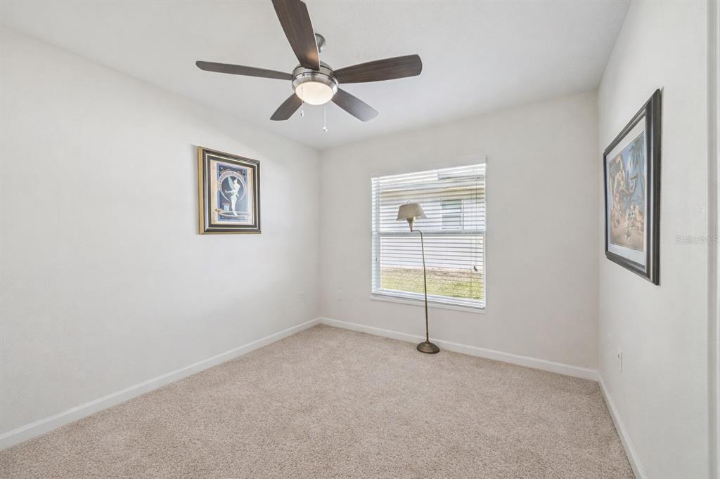 3365 Raleigh Drive Winter Haven, FL 33884 - Photo 11 of 40 an empty room with windows and fan