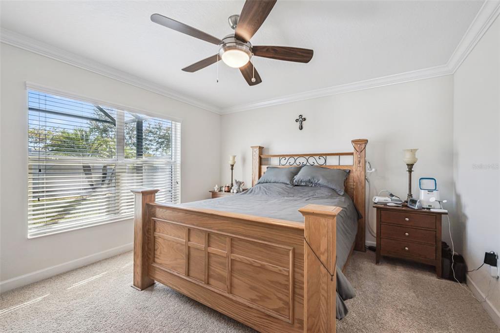 3365 Raleigh Drive Winter Haven, FL 33884 - Photo 12 of 39 a bedroom with a bed and a cabinets