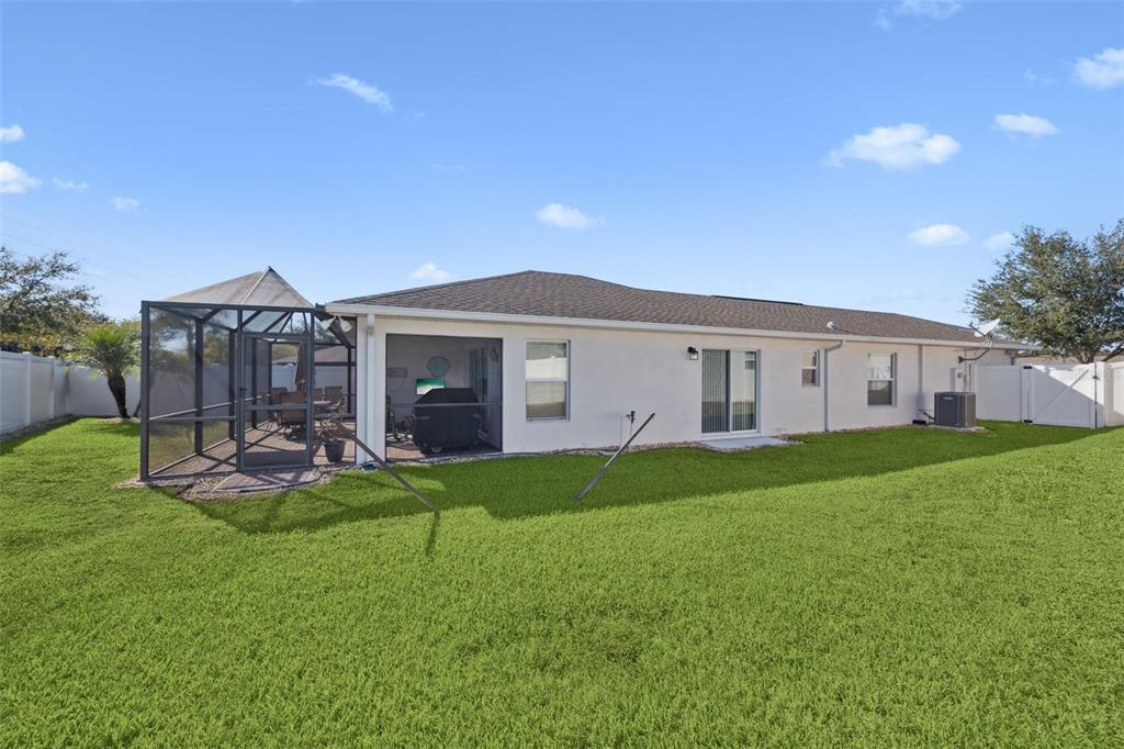 3365 Raleigh Drive Winter Haven, FL 33884 - Photo 21 of 40 a front view of a house with a yard and porch