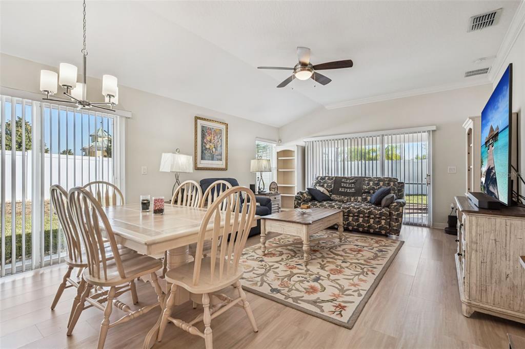 3365 Raleigh Drive Winter Haven, FL 33884 - Photo 3 of 39 a living room with furniture and a flat screen tv