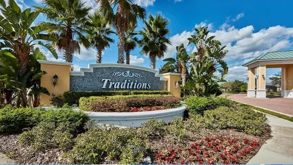 a view of a balcony with lake view and a couple of trees