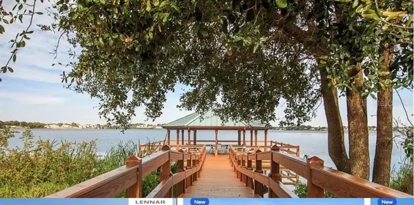 a view of a lake with a yard