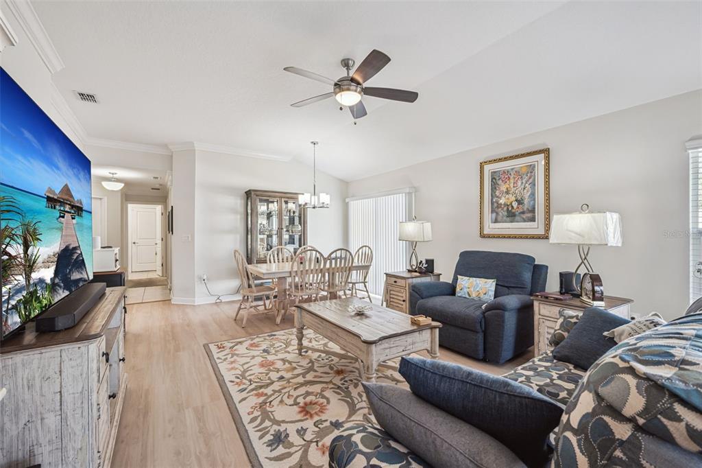 3365 Raleigh Drive Winter Haven, FL 33884 - Photo 6 of 39 a living room with furniture and a wooden floor