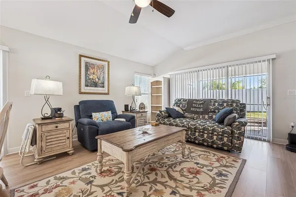 a living room with furniture and a rug