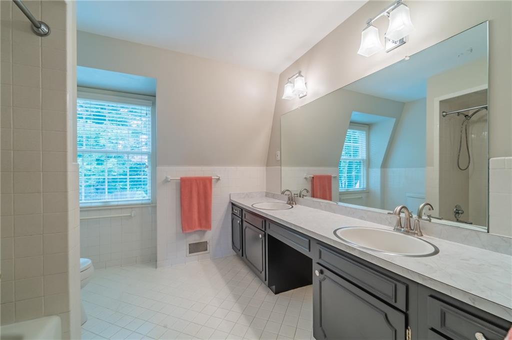 192 Devonwood Drive Pittsburgh, PA 15241 - Photo 18 of 25 a bathroom with a granite countertop sink a vanity and a mirror