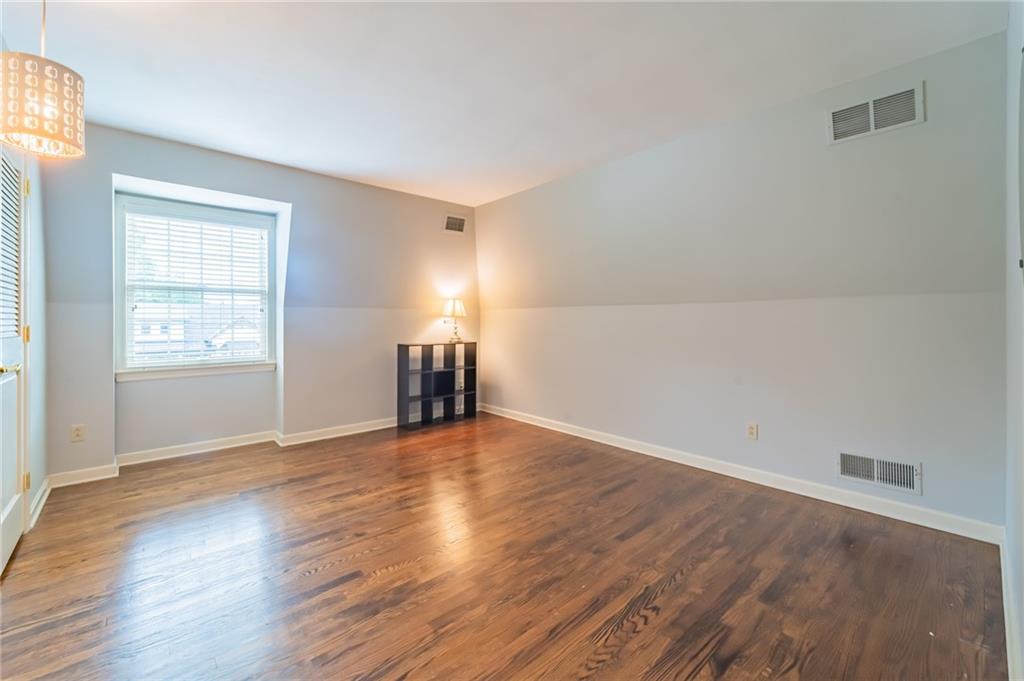 192 Devonwood Drive Pittsburgh, PA 15241 - Photo 20 of 25 an empty room with wooden floor and windows
