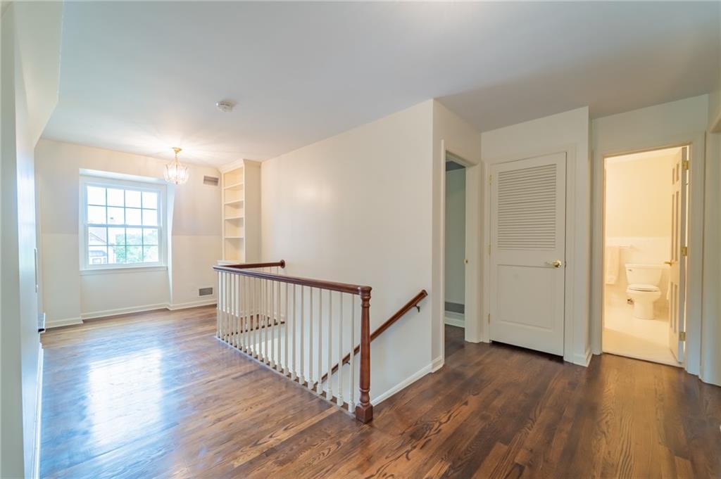 192 Devonwood Drive Pittsburgh, PA 15241 - Photo 21 of 25 an empty room with wooden floor and windows