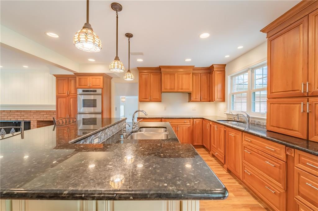 192 Devonwood Drive Pittsburgh, PA 15241 - Photo 8 of 25 a large kitchen with kitchen island a large window a sink and counter space