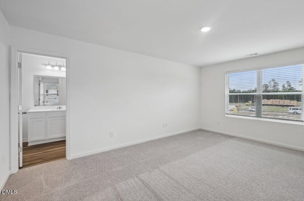2139 Gln Xing Drive Durham, NC 27704 - Photo 15 of 20 a view of an empty room with a window