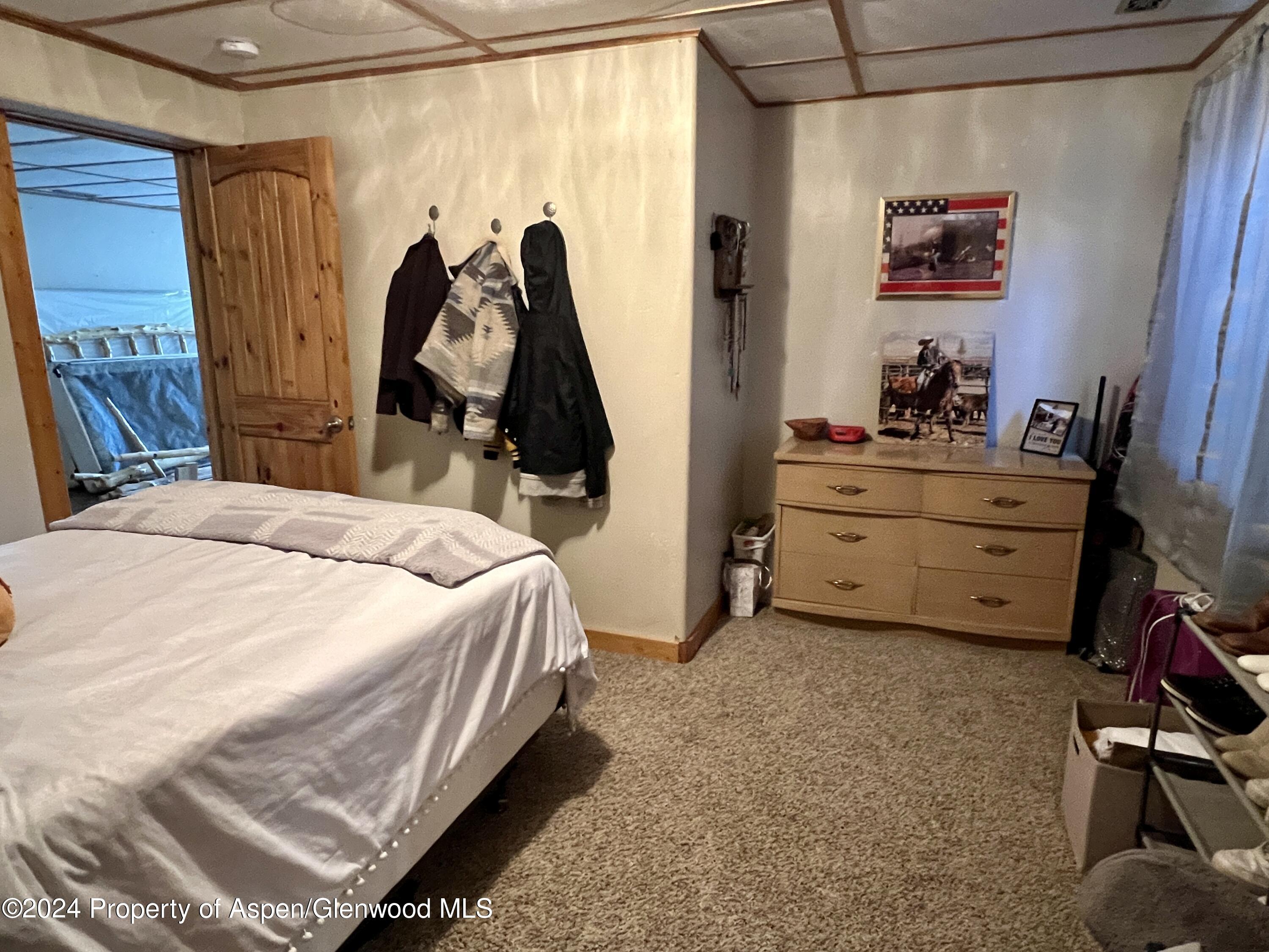 709 Rimrock Drive Meeker, CO 81641 - Photo 17 of 27 a bedroom with a bed and a closet