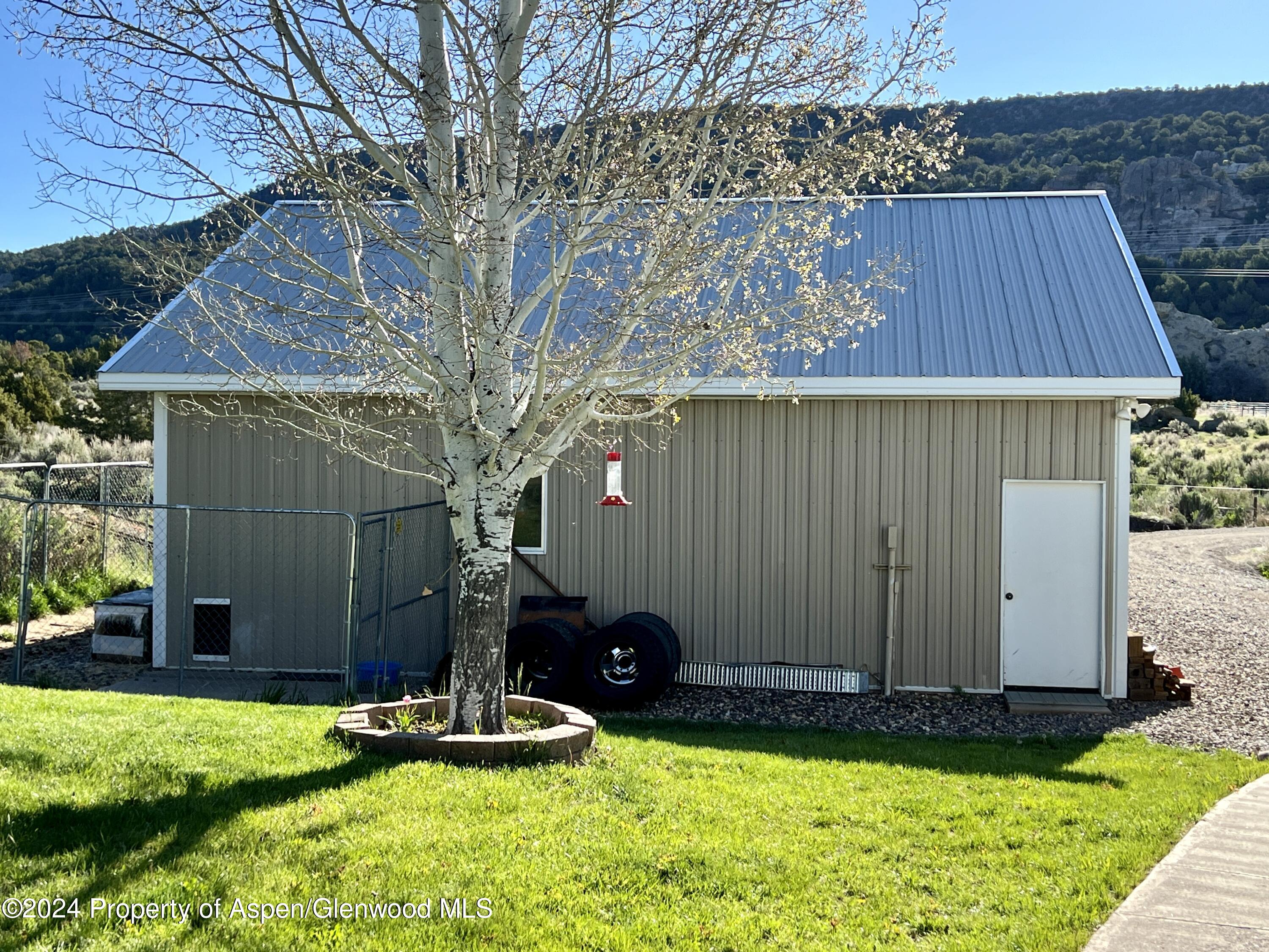 709 Rimrock Drive Meeker, CO 81641 - Photo 20 of 27 a backyard of a house
