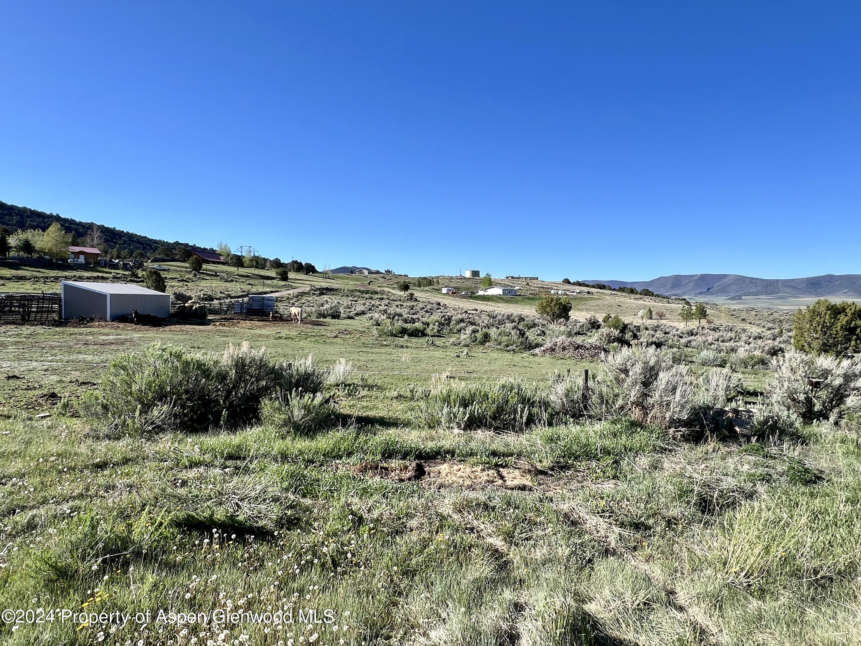 709 Rimrock Drive Meeker, CO 81641 - Photo 25 of 27 a view of a large green field with lots of green space