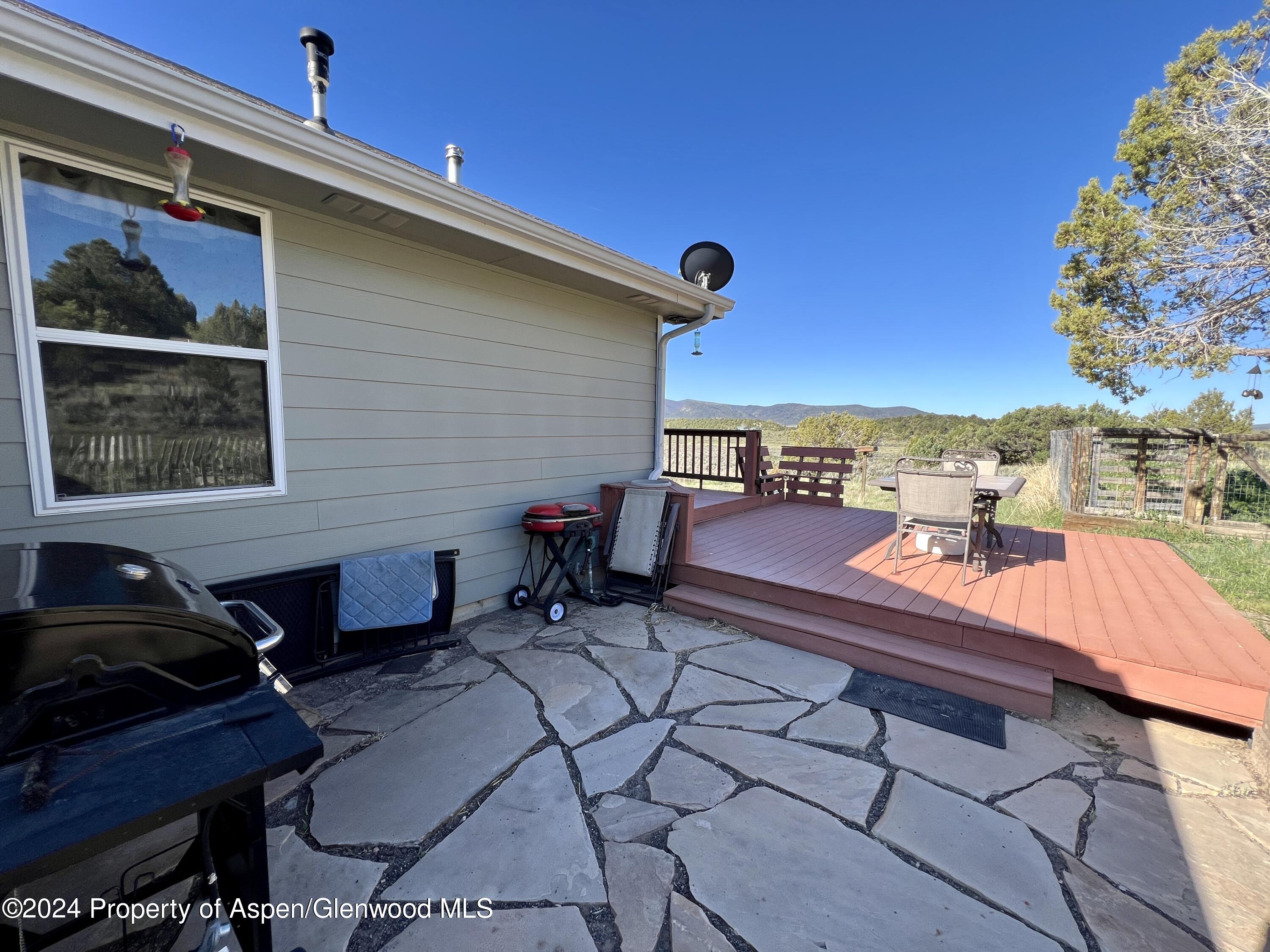709 Rimrock Drive Meeker, CO 81641 - Photo 4 of 27 a backyard of a house with outdoor seating