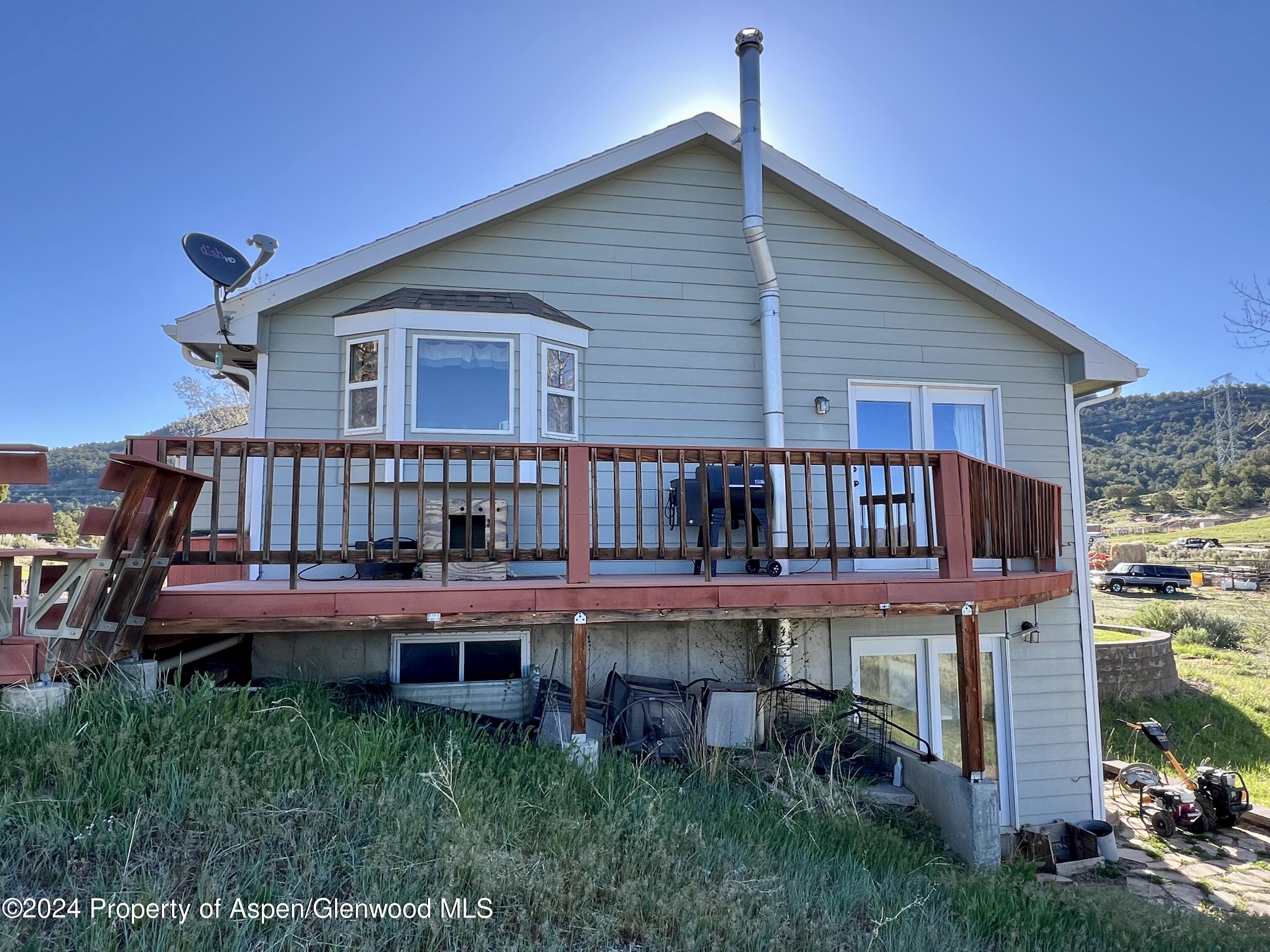 709 Rimrock Drive Meeker, CO 81641 - Photo 5 of 27 a view of a house with roof deck
