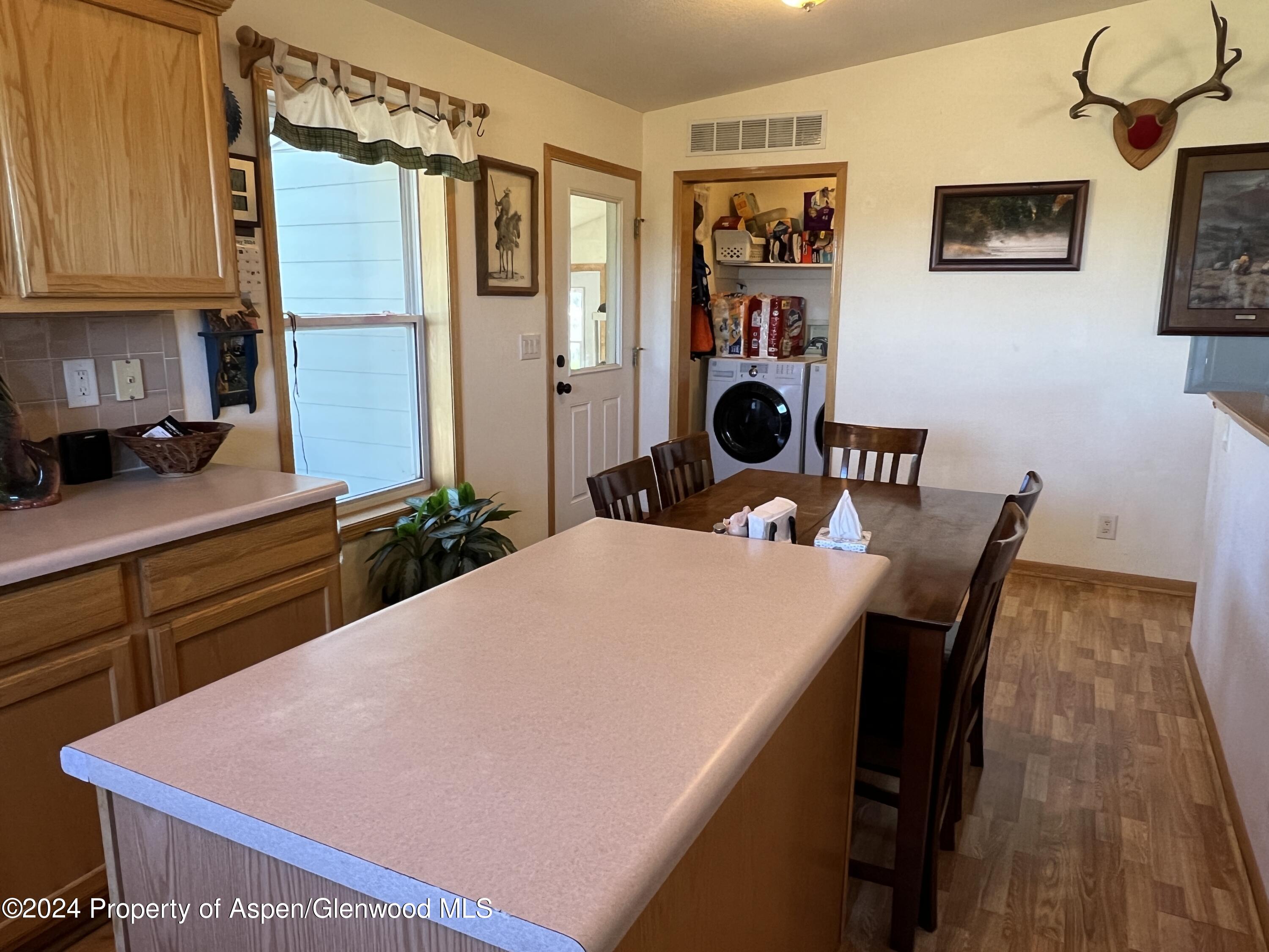 709 Rimrock Drive Meeker, CO 81641 - Photo 10 of 27 a dining room with a table and chairs