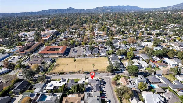 an aerial view of residential houses with outdoor space