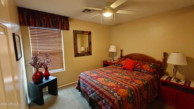 a building outdoor space with patio furniture and potted plants