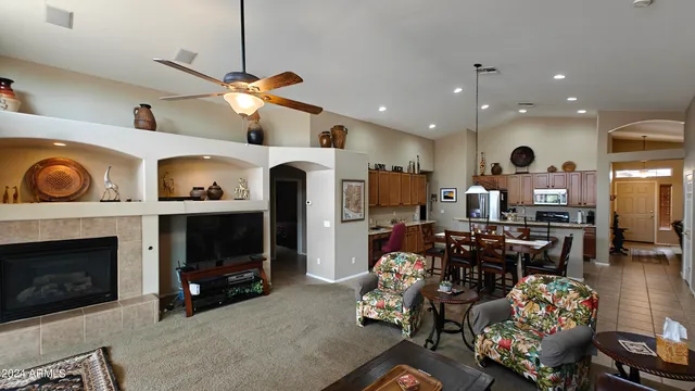 a living room with furniture and a fireplace