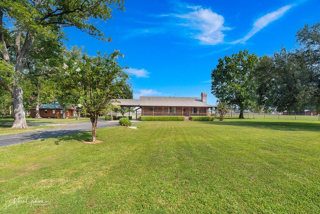4938 Swan Lake Road Bossier City, LA 71111 - Photo 2 of 17 a view of a house with a big yard