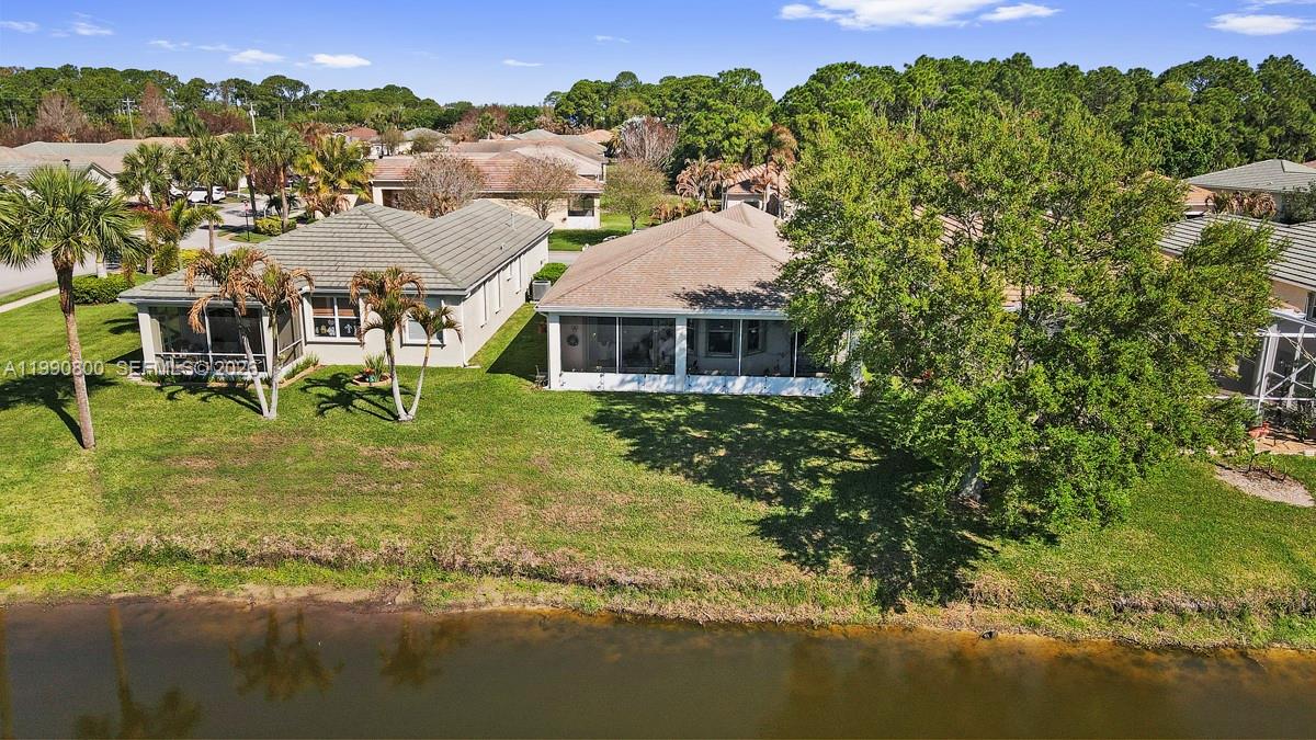 337 Southwest Maclay Way Port St. Lucie, FL 34986 - Photo 26 of 44 an aerial view of residential houses with outdoor space and trees