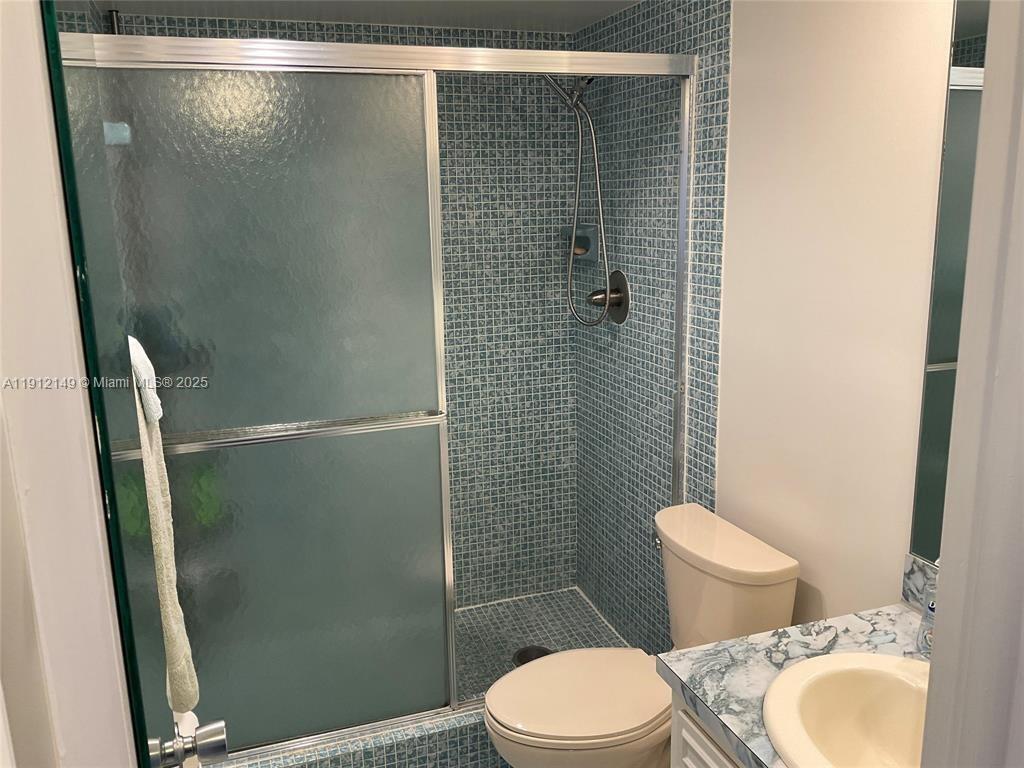 3080 North Course Drive, Unit 209 Pompano Beach, FL 33069 - Photo 16 of 35 a bathroom with a toilet and a shower