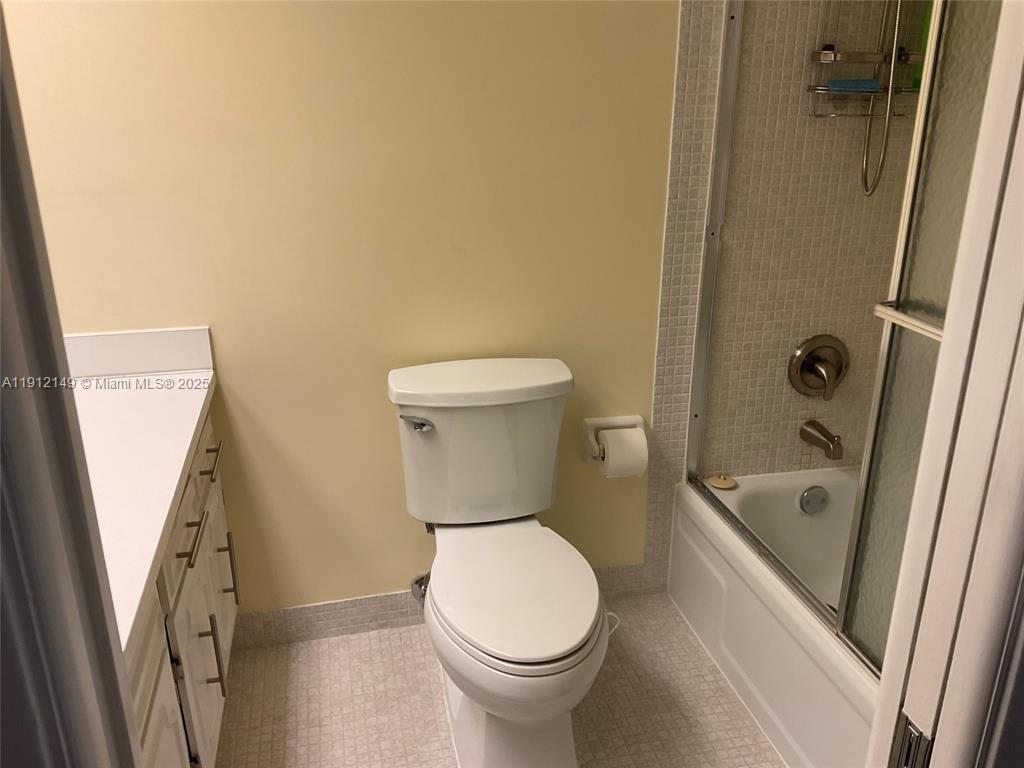 3080 North Course Drive, Unit 209 Pompano Beach, FL 33069 - Photo 17 of 35 a bathroom with a toilet and a tub