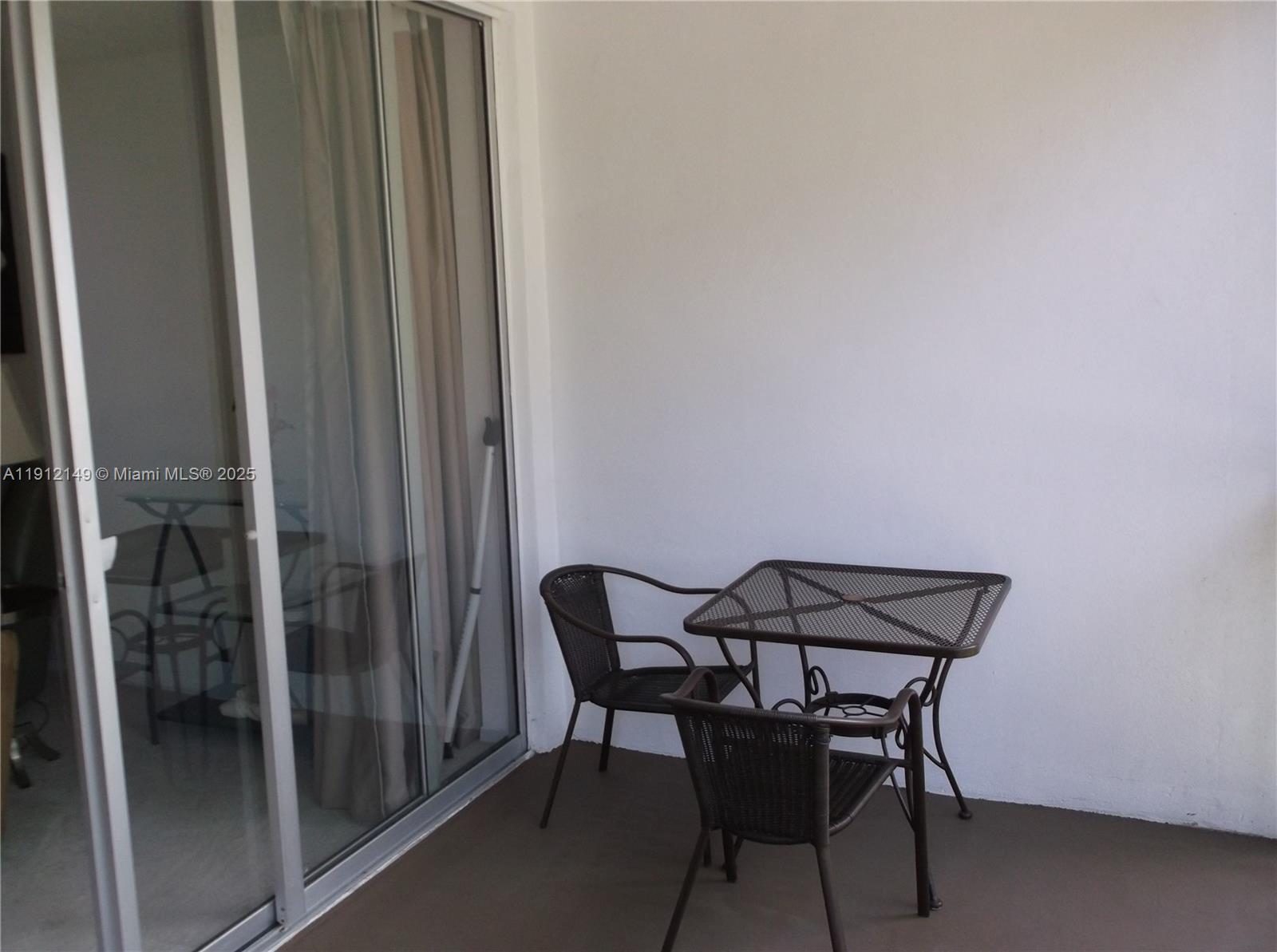 3080 North Course Drive, Unit 209 Pompano Beach, FL 33069 - Photo 21 of 35 a view of a room with table and chair