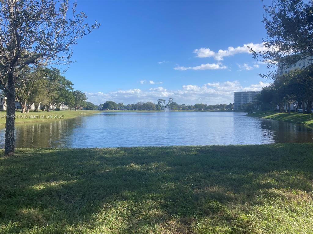 3080 North Course Drive, Unit 209 Pompano Beach, FL 33069 - Photo 28 of 35 a view of a lake with a big yard