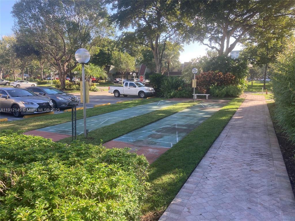 3080 North Course Drive, Unit 209 Pompano Beach, FL 33069 - Photo 32 of 35 a view of a park that has a tree on the side of it