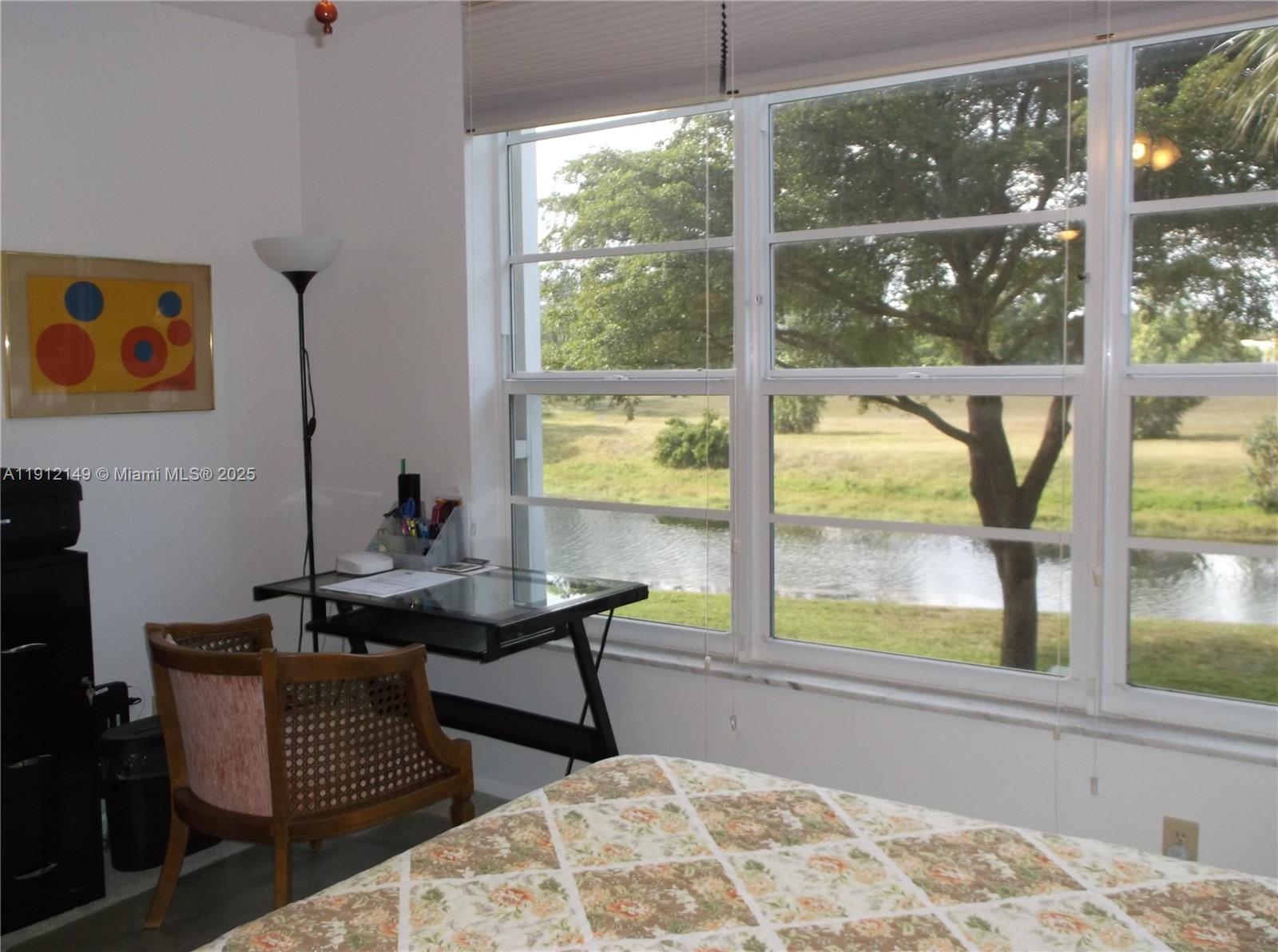 3080 North Course Drive, Unit 209 Pompano Beach, FL 33069 - Photo 8 of 35 a bedroom with a bed and a window