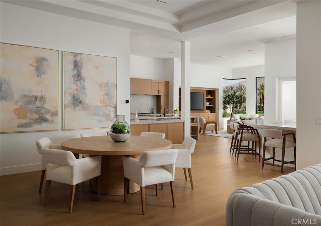 76476 Via Chianti Indian Wells, CA 92210 - Photo 12 of 74 a view of a dining room with furniture and wooden floor