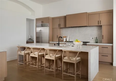 a kitchen with stainless steel appliances granite countertop a stove and a microwave