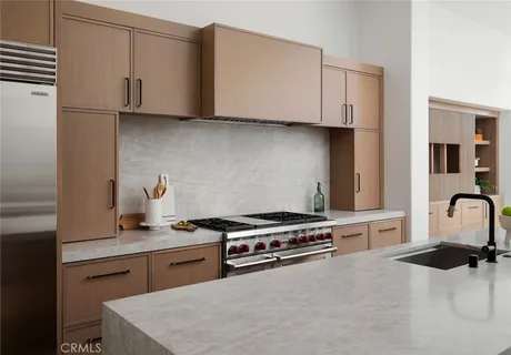 a living room with furniture a flat screen tv and a potted plant