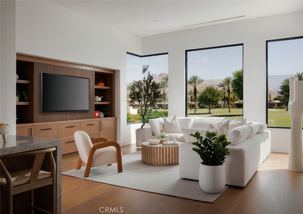 76476 Via Chianti Indian Wells, CA 92210 - Photo 17 of 74 a living room with furniture potted plant and a flat screen tv