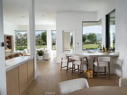 a spacious bedroom with a large bed and a window