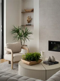 a living room with furniture and mirror