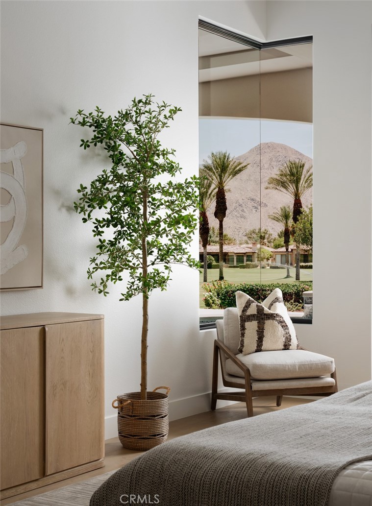 76476 Via Chianti Indian Wells, CA 92210 - Photo 26 of 74 a living room with furniture and a potted plant