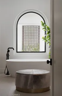 a view of a garden with lawn chairs