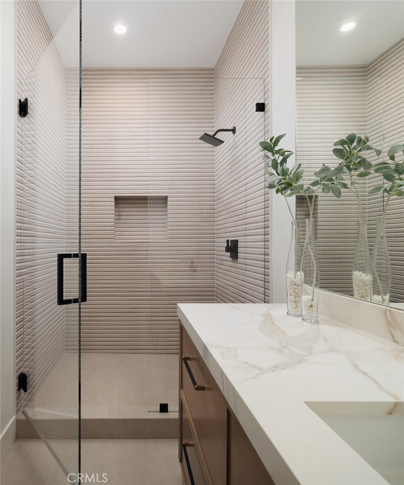 76476 Via Chianti Indian Wells, CA 92210 - Photo 33 of 74 a bathroom with a sink a mirror and a shower
