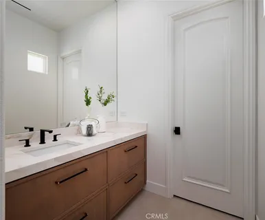 a view of a house with snow on the road