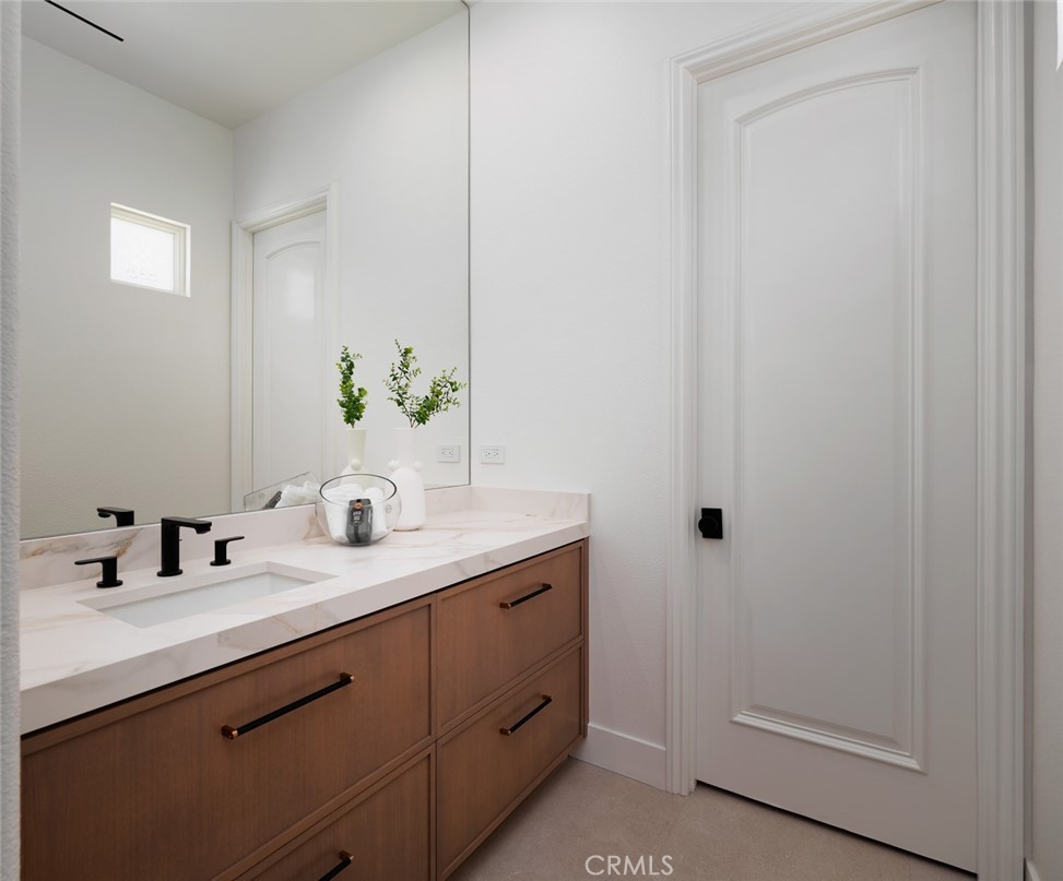76476 Via Chianti Indian Wells, CA 92210 - Photo 35 of 74 a bathroom with a double vanity sink and a mirror