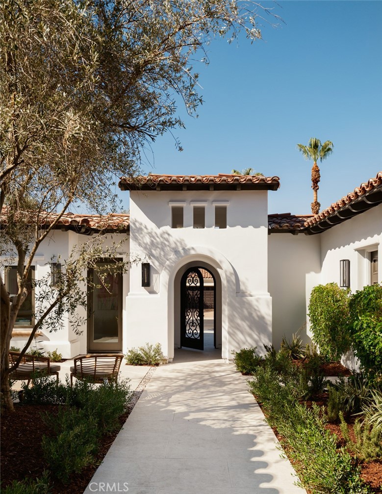 76476 Via Chianti Indian Wells, CA 92210 - Photo 52 of 74 front view of a house with a garden