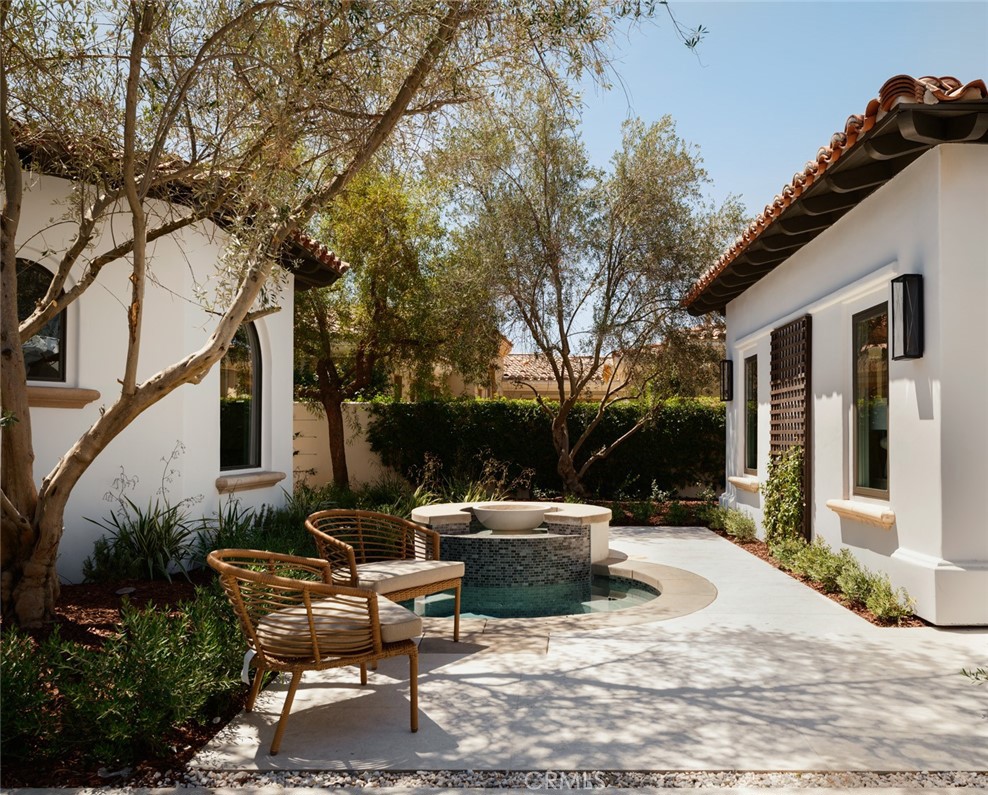 76476 Via Chianti Indian Wells, CA 92210 - Photo 53 of 74 a view of backyard of house with outdoor seating