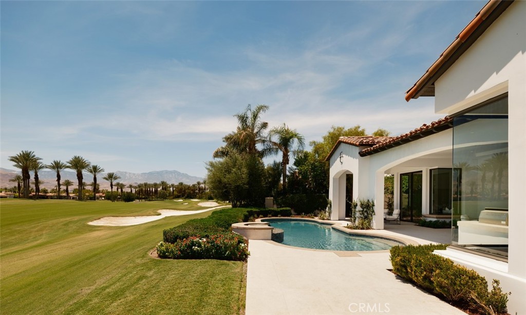 76476 Via Chianti Indian Wells, CA 92210 - Photo 62 of 74 a view of a swimming pool and lounge chairs