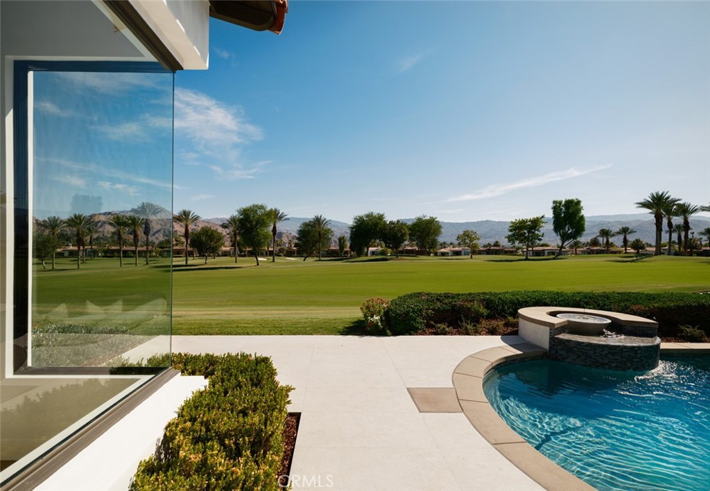 76476 Via Chianti Indian Wells, CA 92210 - Photo 63 of 74 a view of a lake with a yard